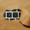 A piece of cardboard with a keyboard appearing through it
