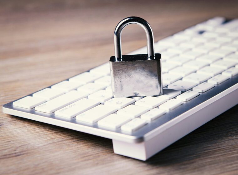 a computer keyboard with a padlock on top of it