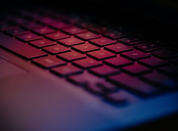 a-close-up-of-a-keyboard-with-a-blurry-background