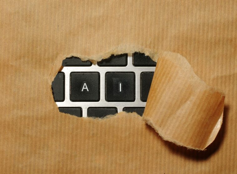 A piece of cardboard with a keyboard appearing through it